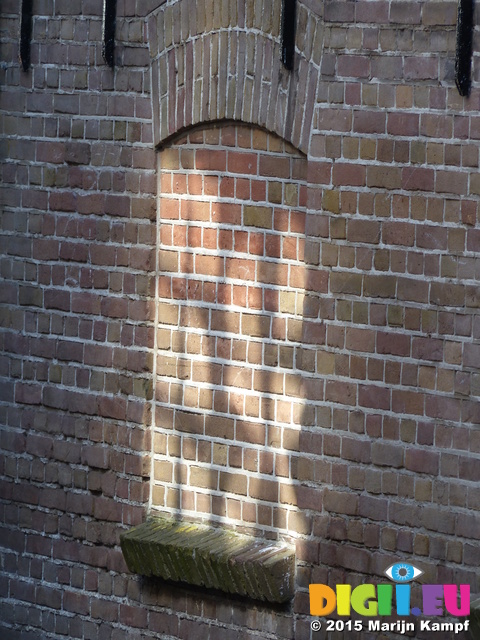 FZ019760 Reflection of window panes on bricked up window